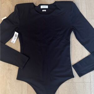 Babaton
Contour Shoulder Pad Bodysuit
Tank top bodysuit with shoulder pads